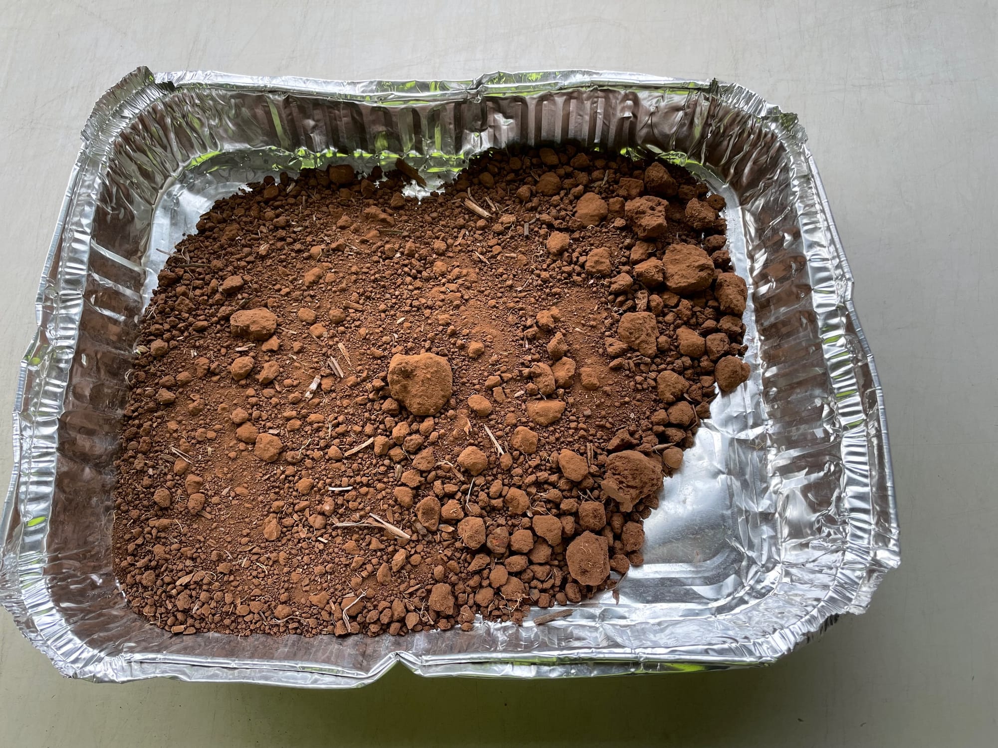 Soil in aluminium tray after drying.